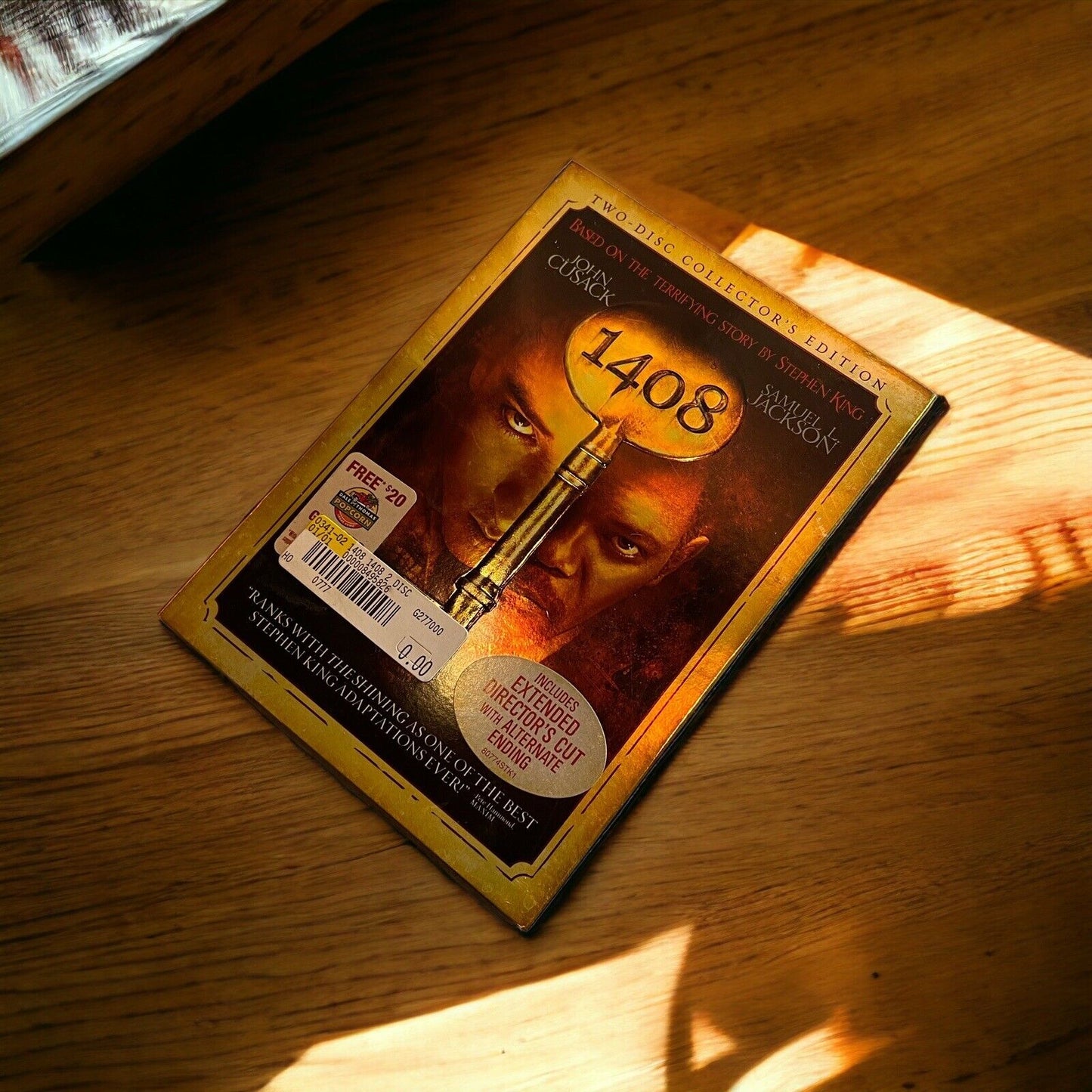 Stephen King 1408 2-disc DVD collector's edition case on wooden surface with sunlight