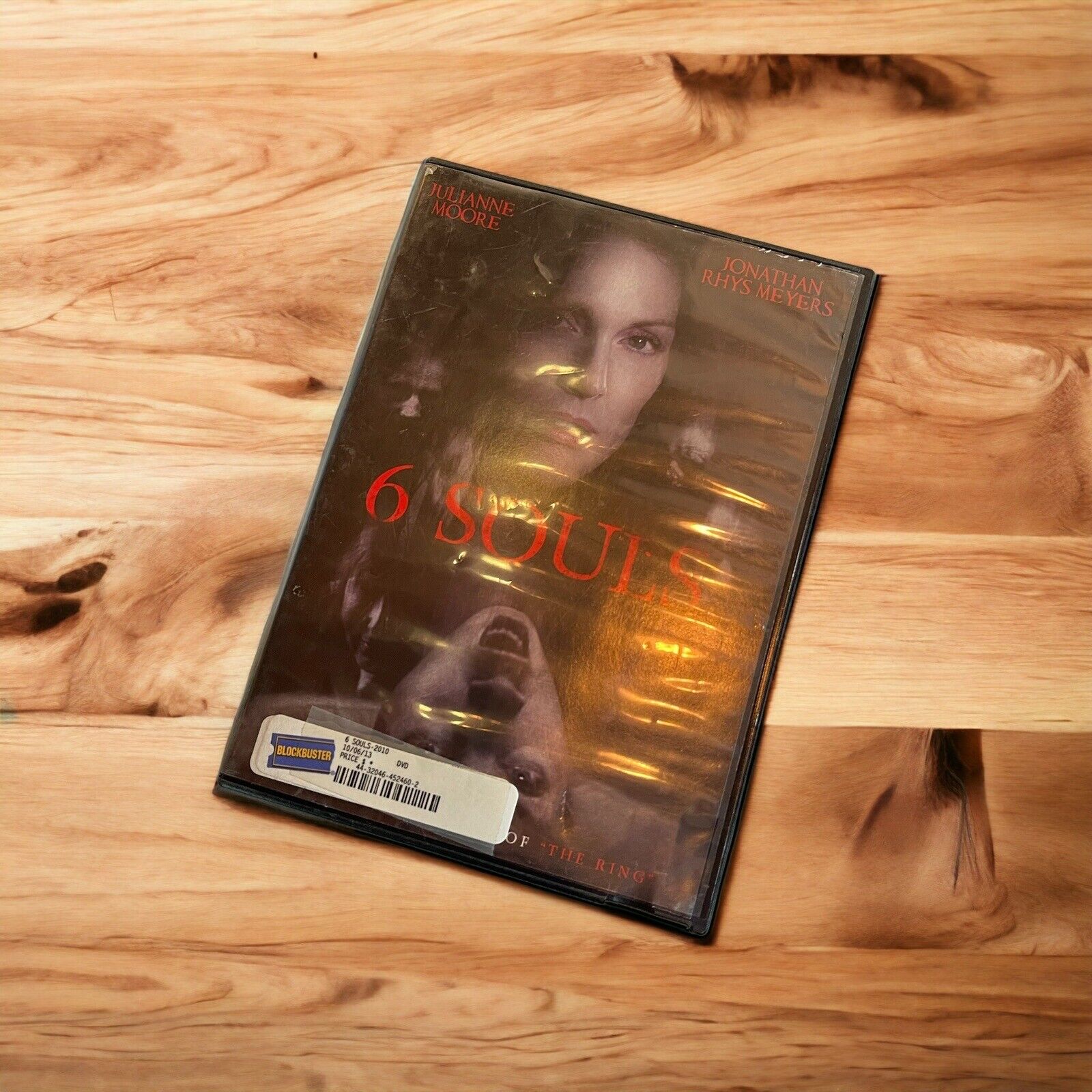 6 Souls 2013 Blockbuster edition DVD case featuring Marianne Moore on wooden surface