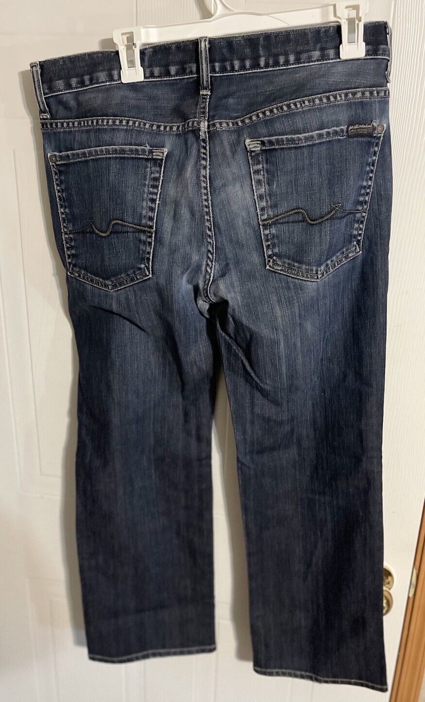 7 For All Mankind Austyn Jeans in dark blue denim with back pockets and stitched detailing