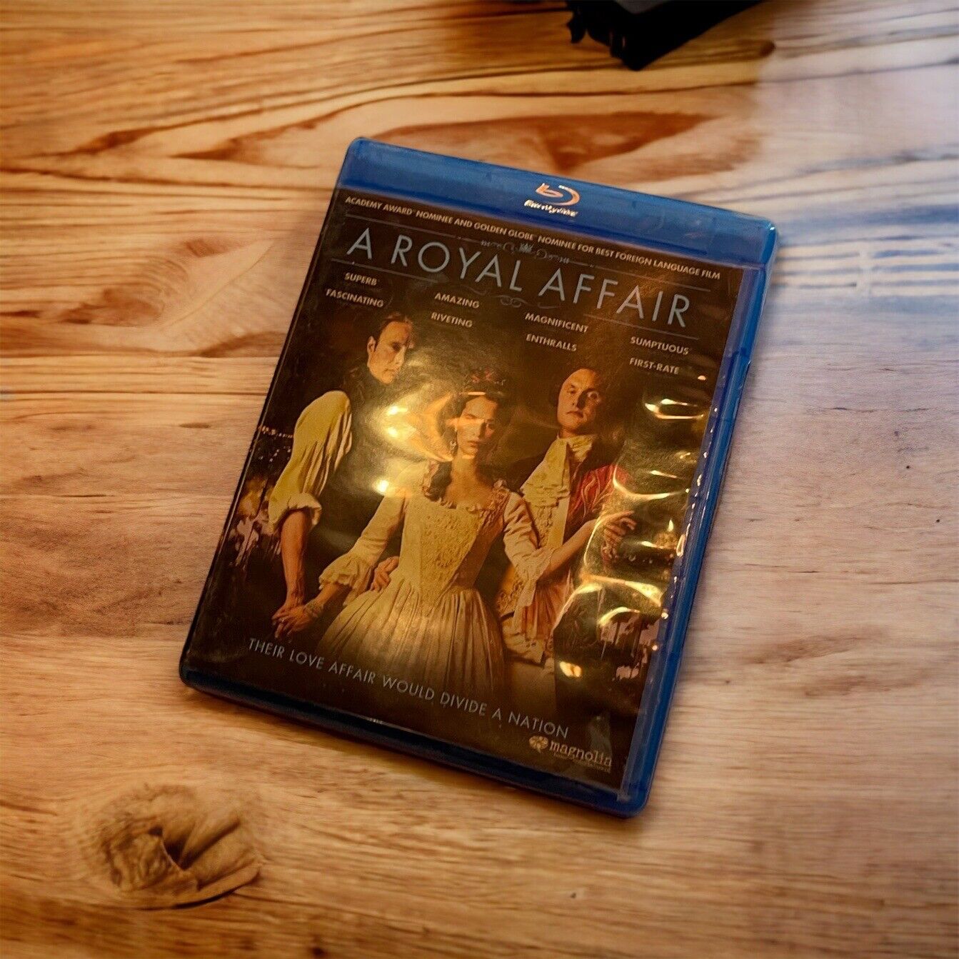 A Royal Affair Blu-ray disc case featuring historical drama cover with three characters on wooden table