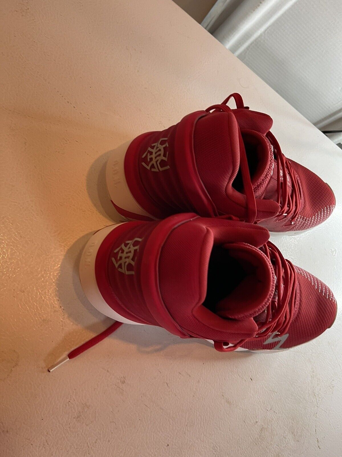 Red adidas D.O.N. Issue 2 size 13 basketball shoes with white sole and detailed stitching
