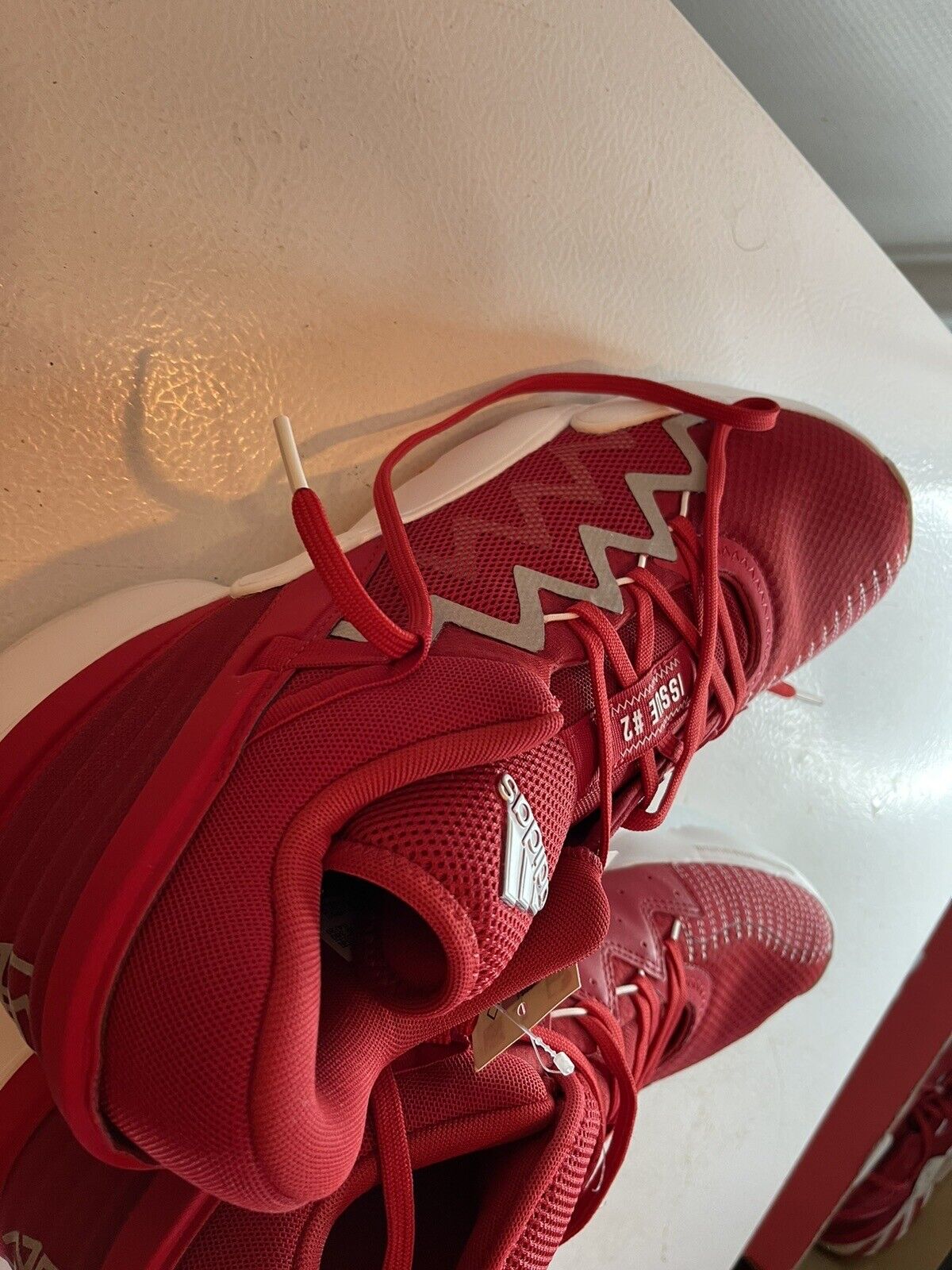 Red adidas d.o.n. issue 2 size 13.5 basketball shoes with white zigzag design and mesh upper
