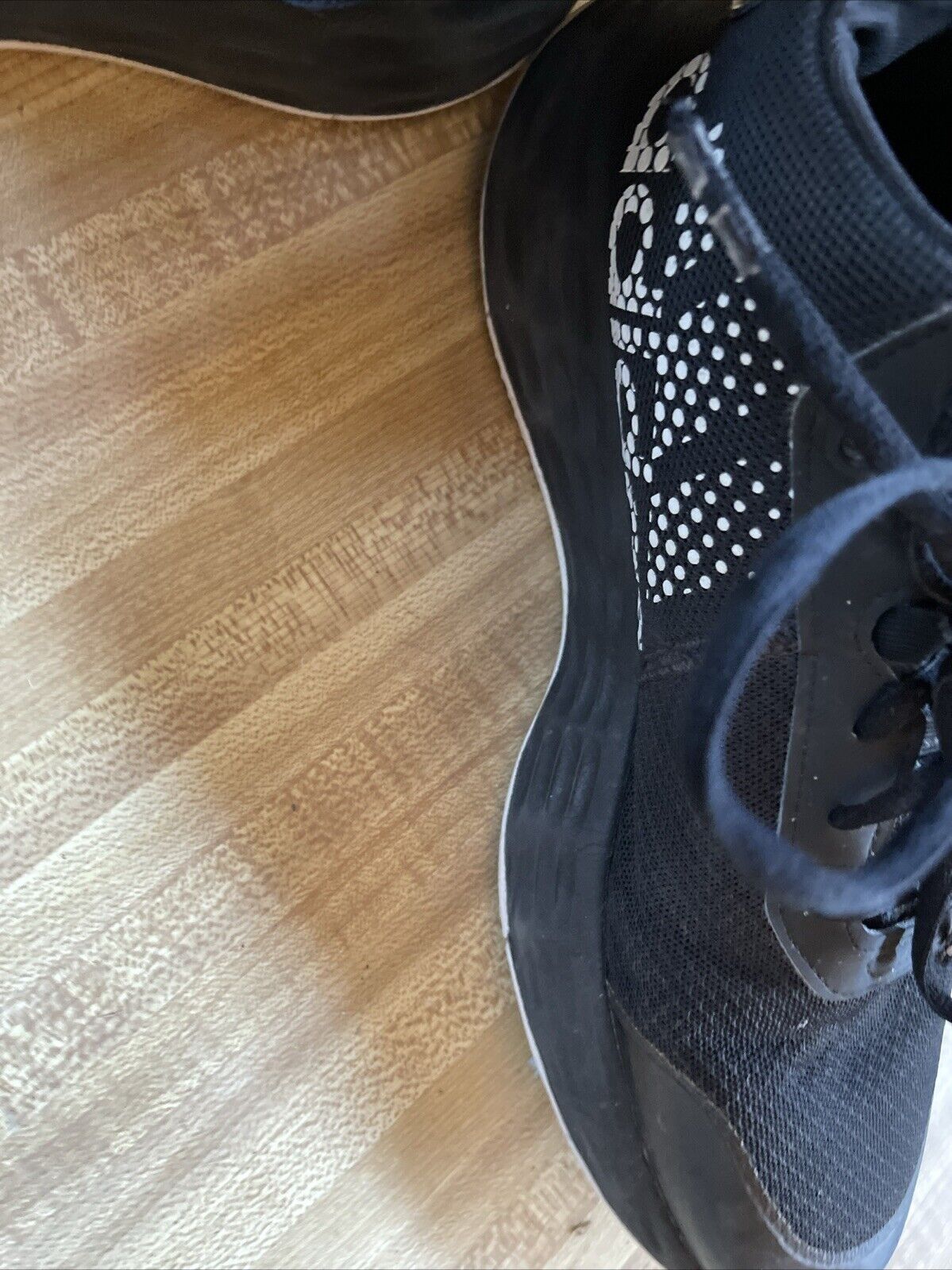 Black adidas lightmotion size 11 athletic shoe with breathable mesh and cushioned sole