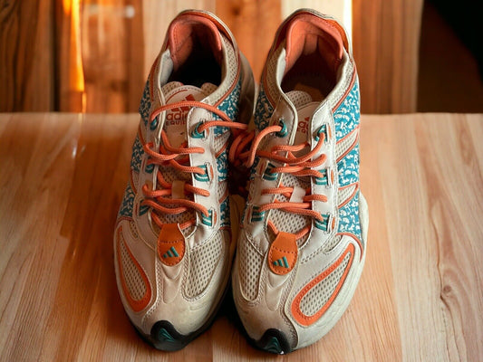 Adidas Originals FYW S-97 sneakers in beige with orange and teal accents on wooden floor