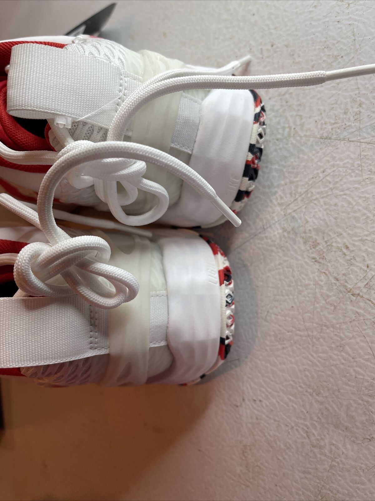 Top view of Adidas SM Exhibit A Team USA sneakers in white with red accents and detailed laces