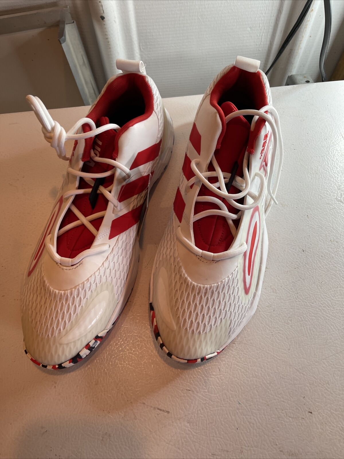 White and red Adidas SM Exhibit A Team USA sneakers with mesh upper and patterned sole