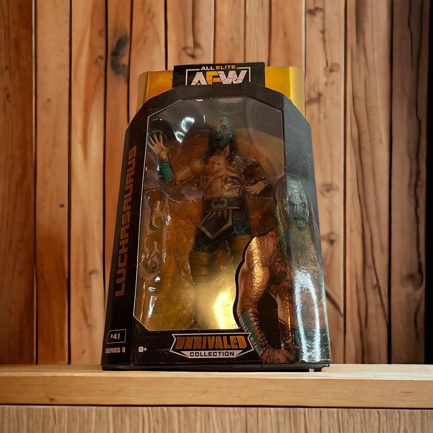 AEW Luchasaurus action figure in black and gold Unrivaled Collection packaging by 1118 Emporium