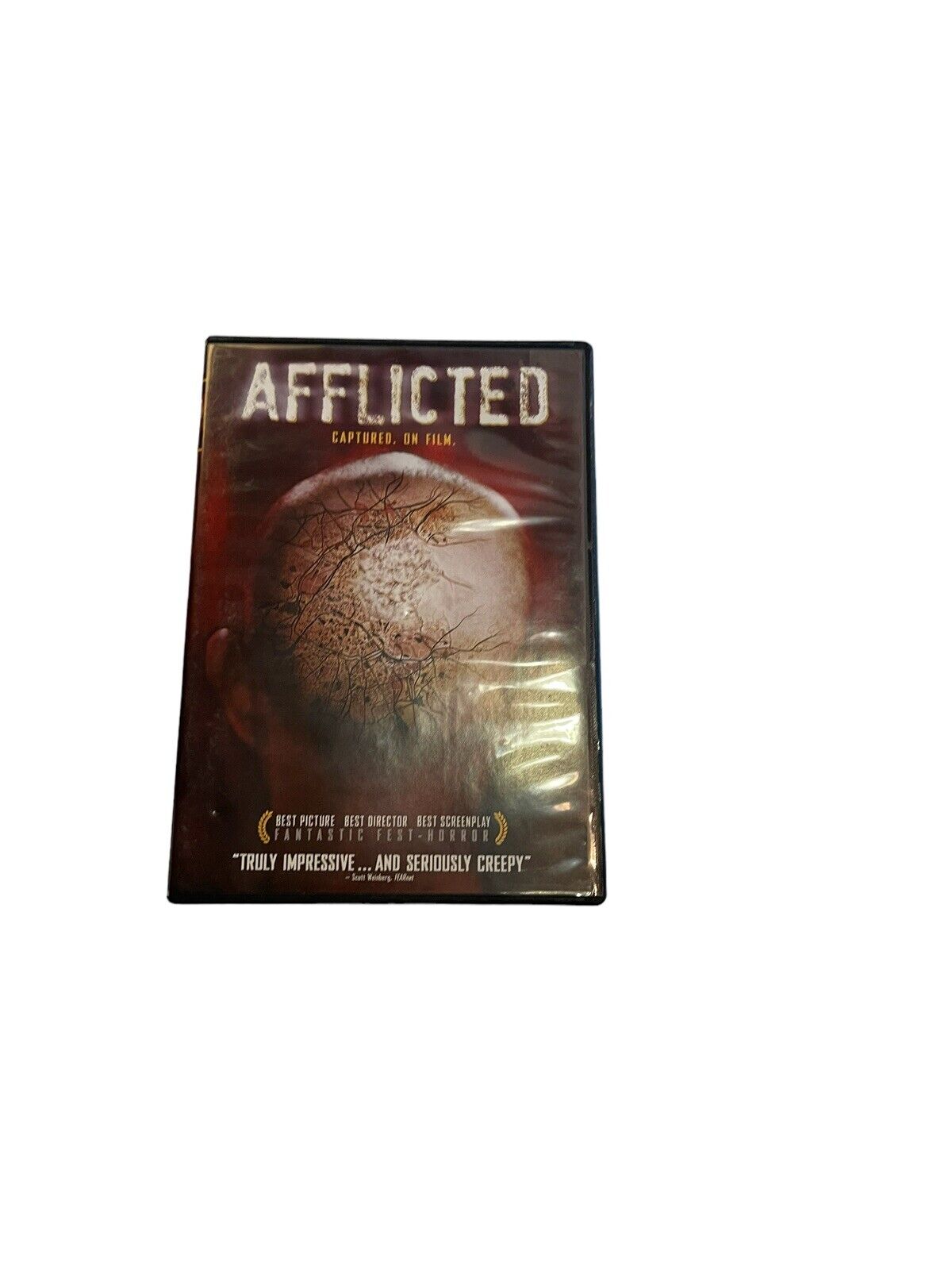 Afflicted 2013 DVD cover showing a cracked face with horror movie design by 1118 Emporium