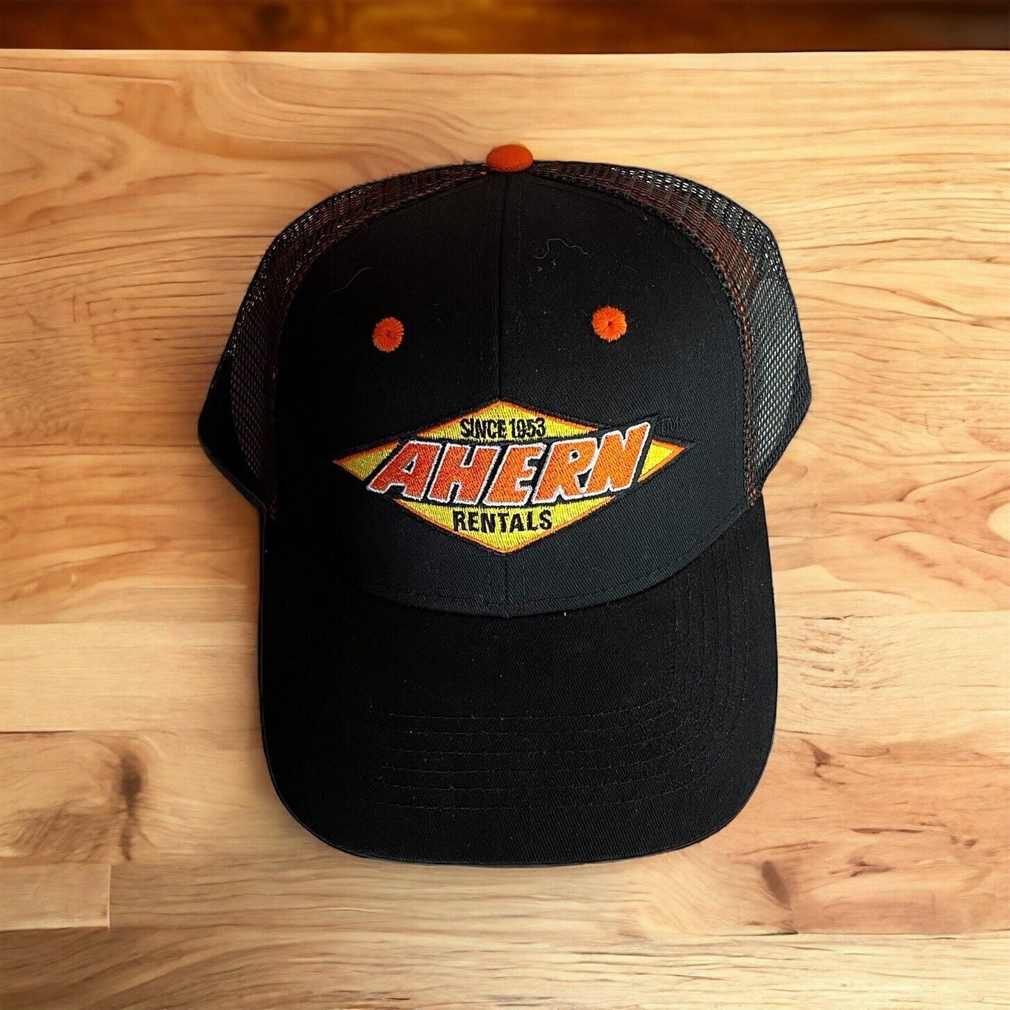 Black Ahern Rentals snapback hat with orange and yellow embroidered logo and mesh back from 1118 Emporium