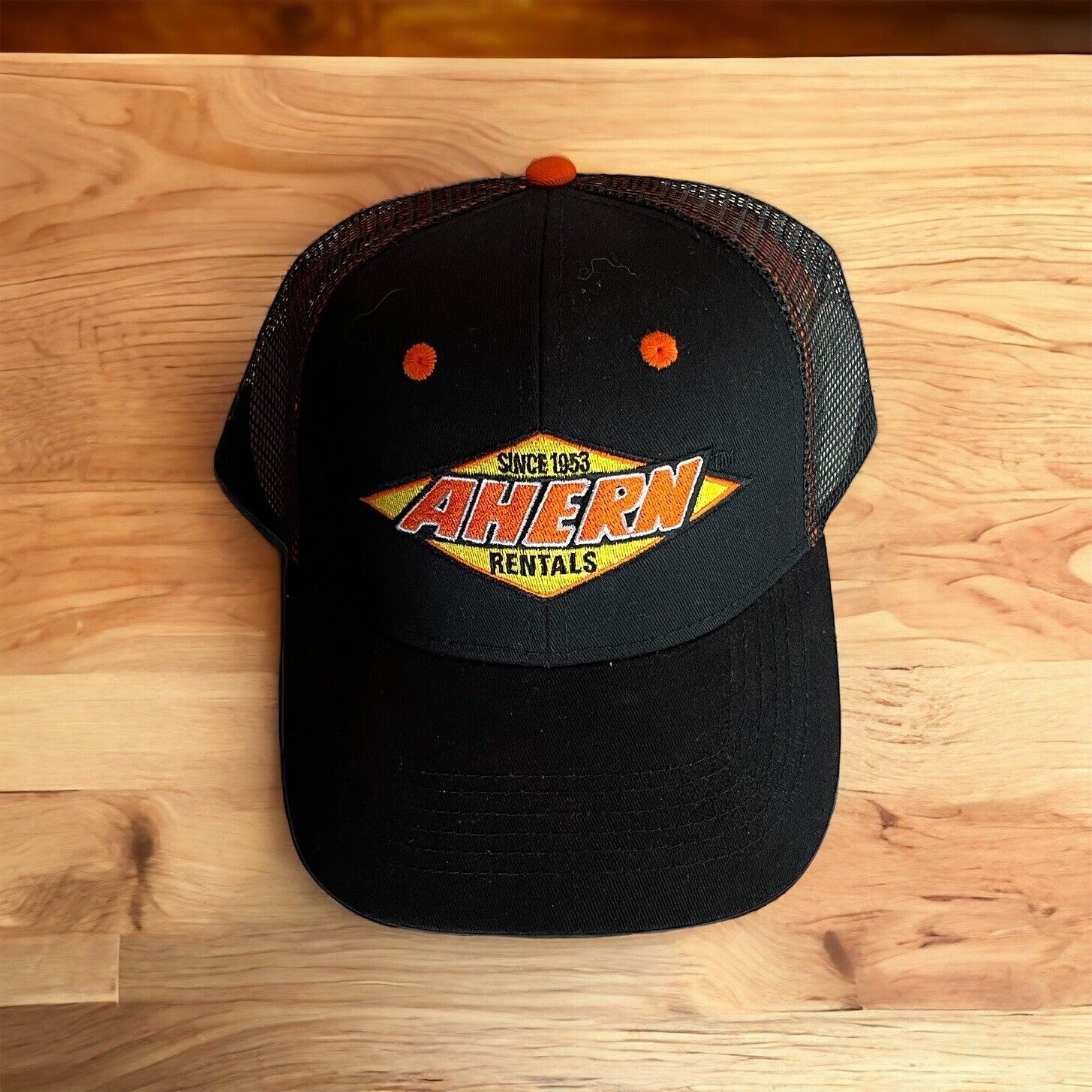 Black Ahern Rentals snapback hat with orange and yellow embroidered logo and mesh back from 1118 Emporium