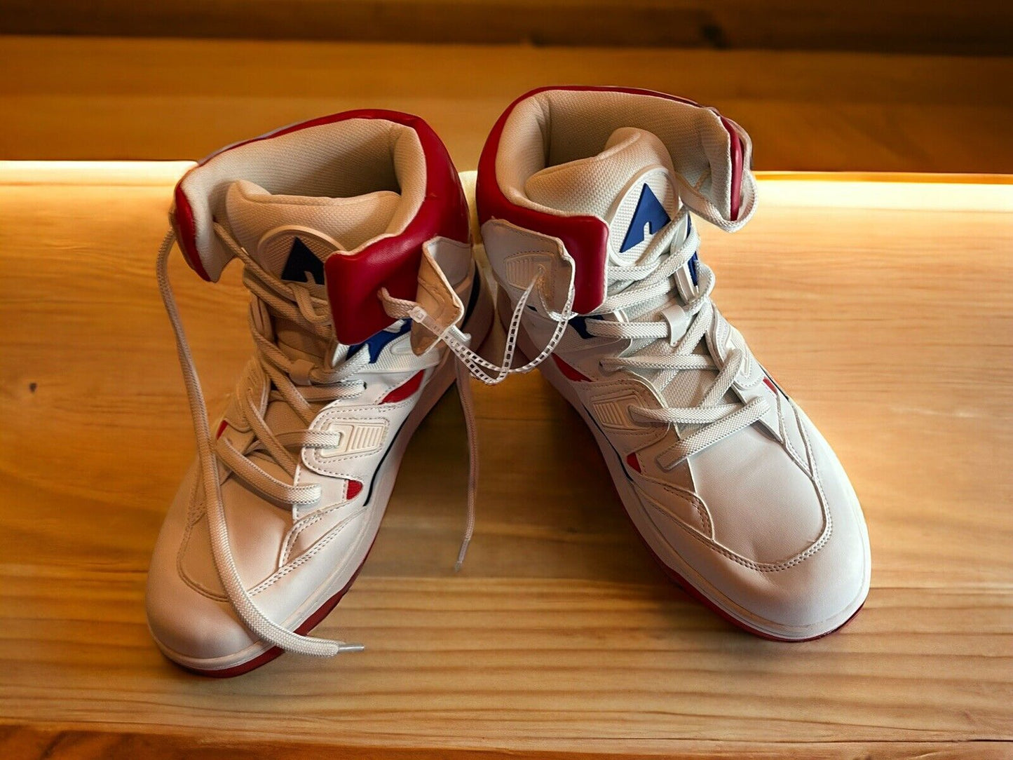 Airwalk men’s sneakers size 10 white high-top shoes with red and blue accents on wooden surface
