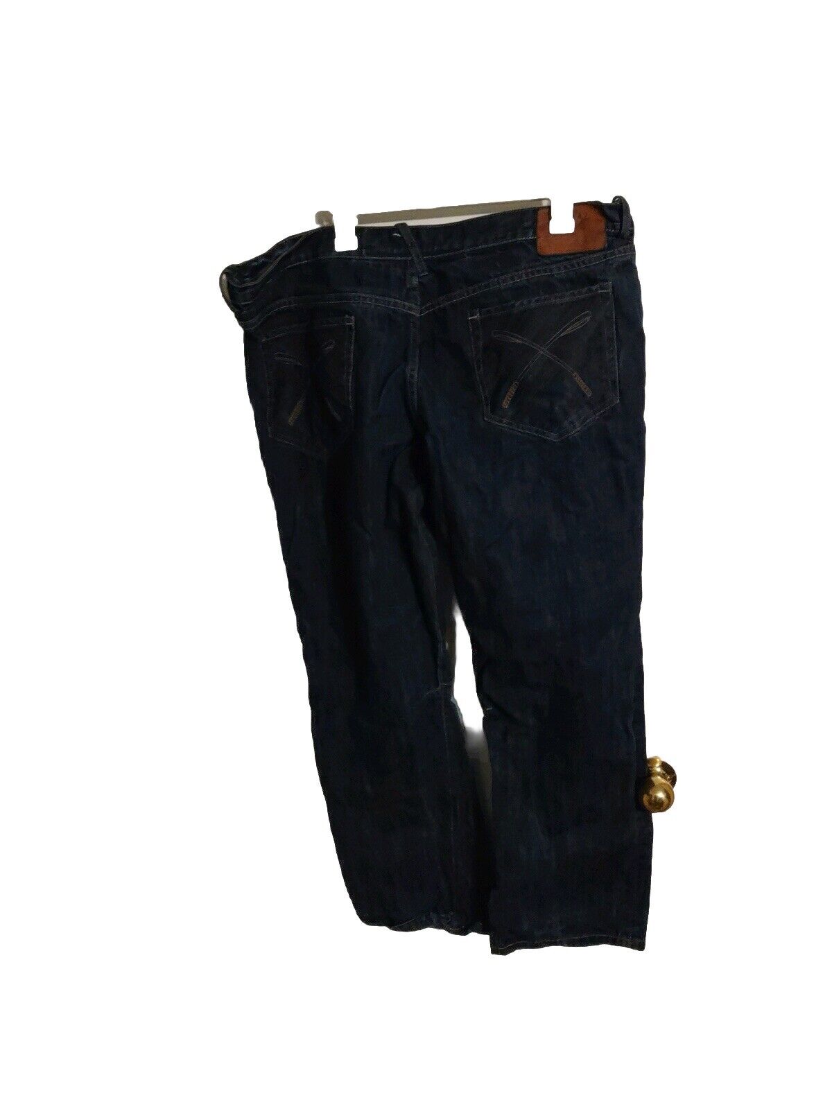 Dark wash akoo jeans size 42 hanging showing back pockets and stitching details