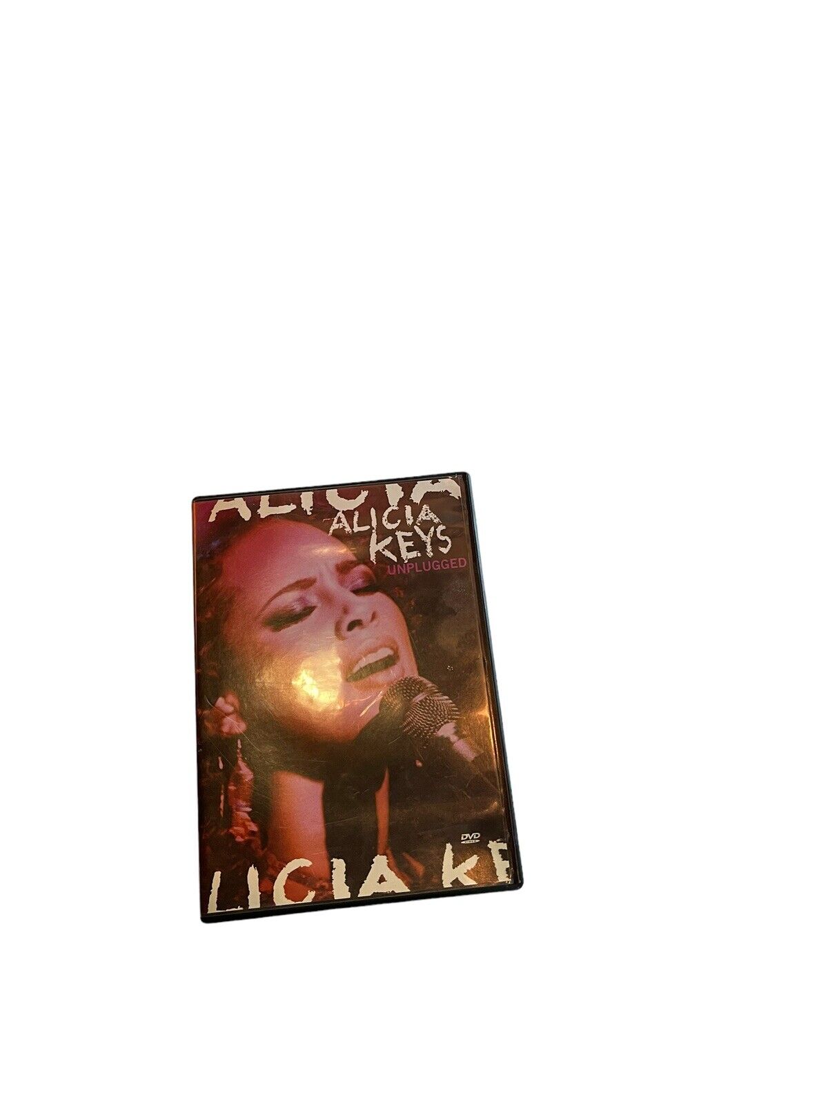 Alicia Keys MTV Unplugged DVD cover featuring a close-up of Alicia Keys singing into a microphone