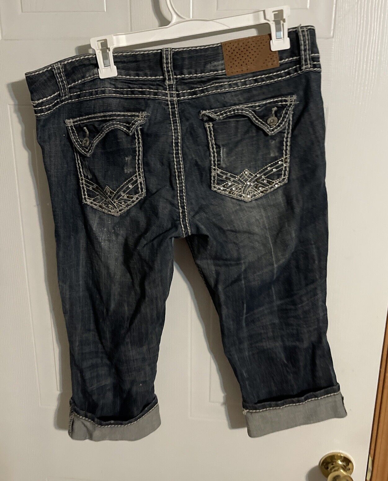 Dark wash Almost Famous capri jeans size 15 with embroidered back pockets and rolled cuffs