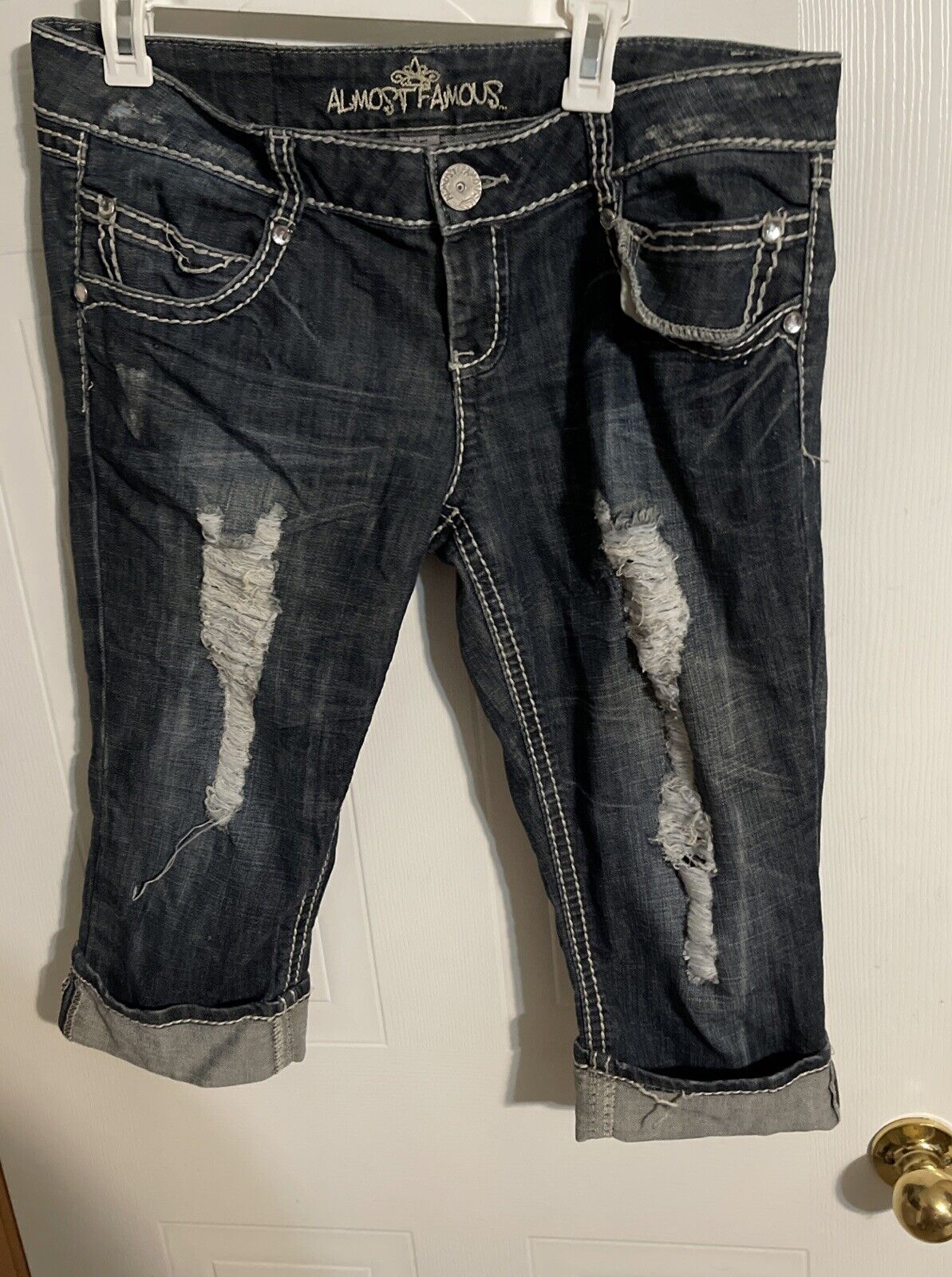 Almost Famous capri jeans size 15 in dark distressed denim with rolled cuffs and contrast stitching