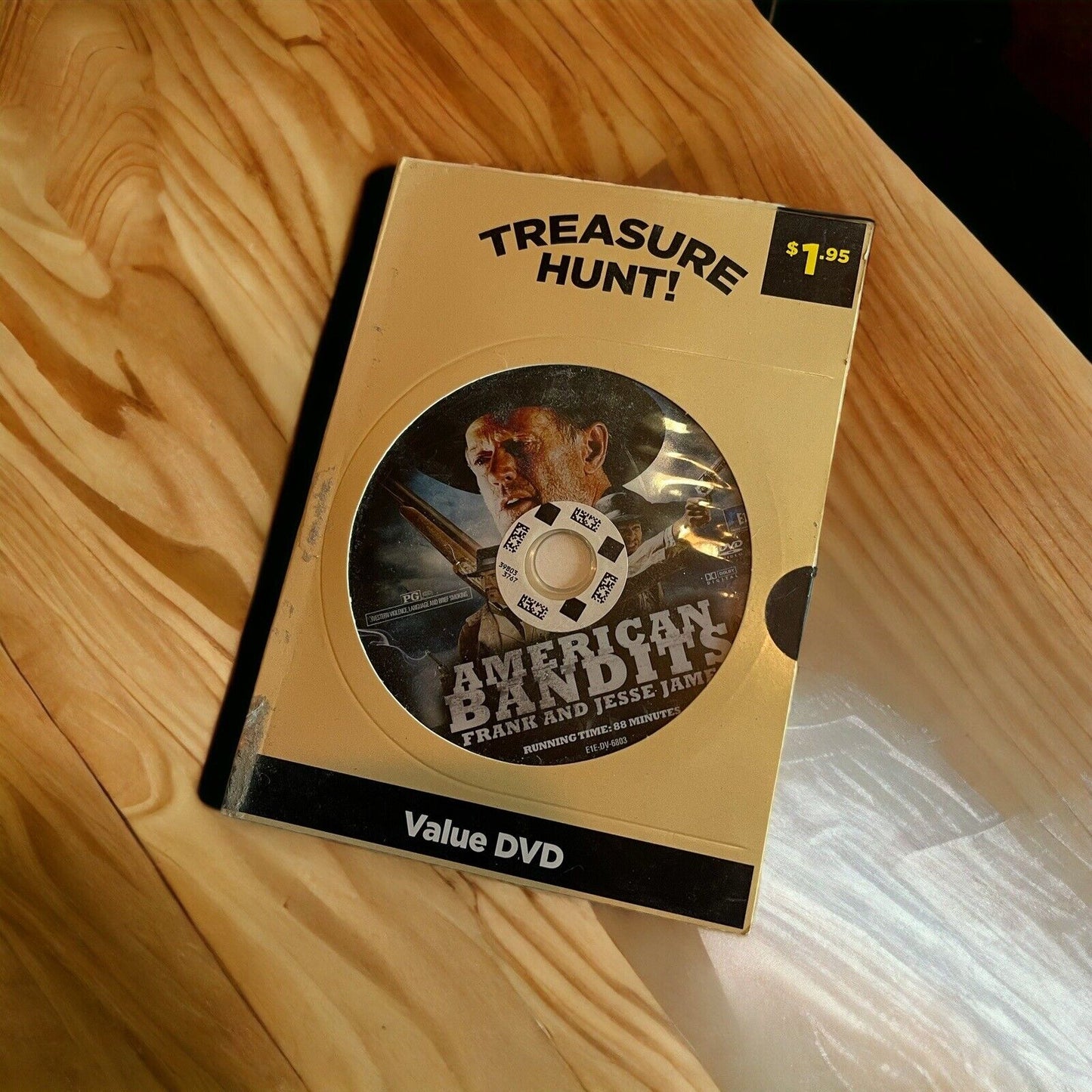 American Bandits Frank and Jesse James DVD in vintage Treasure Hunt packaging on wooden surface