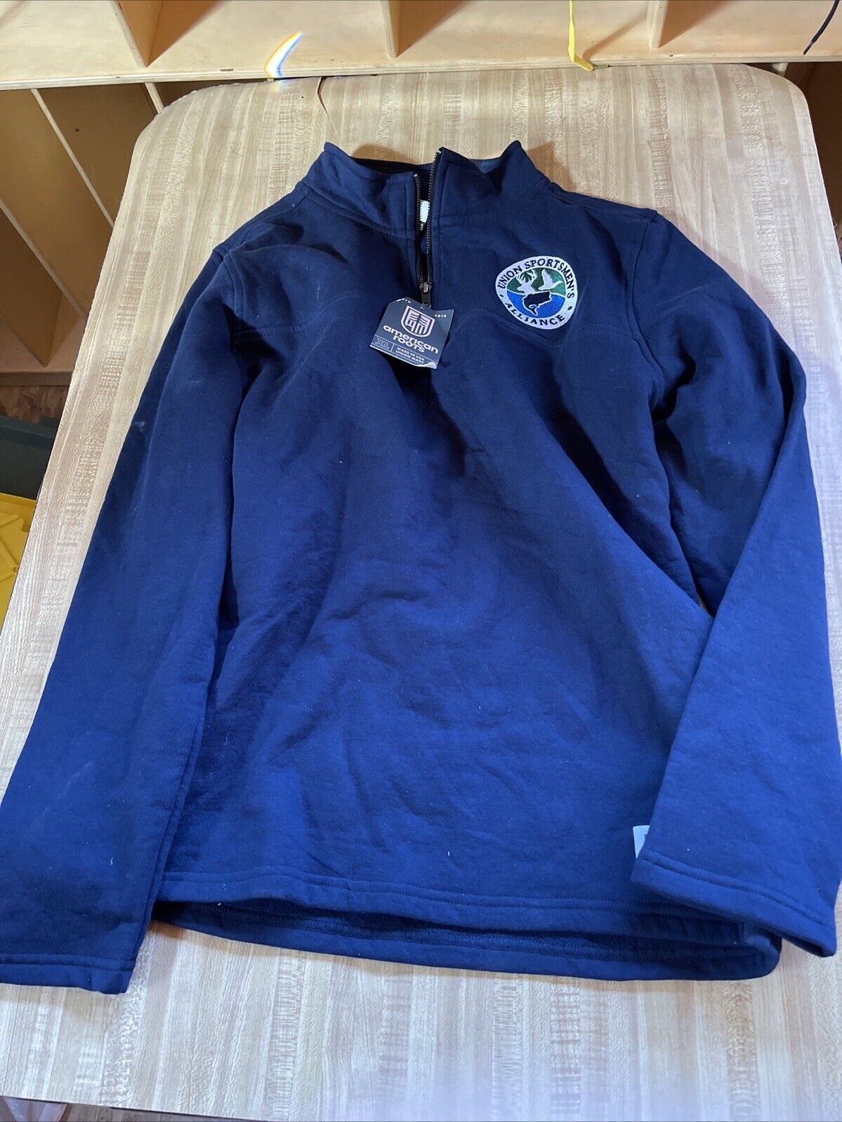 Navy blue American Roots quarter zip pullover with embroidered logo and tag from 1118 Emporium