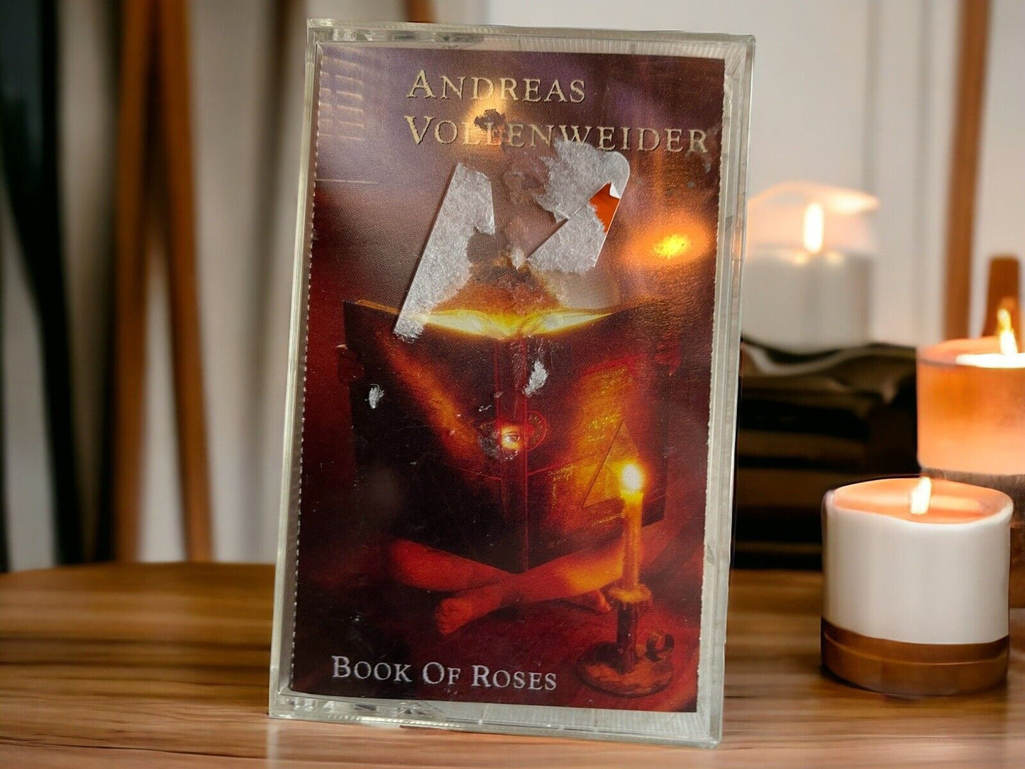 Andreas Vollenweider Book of Roses cassette tape on wooden table with lit candles