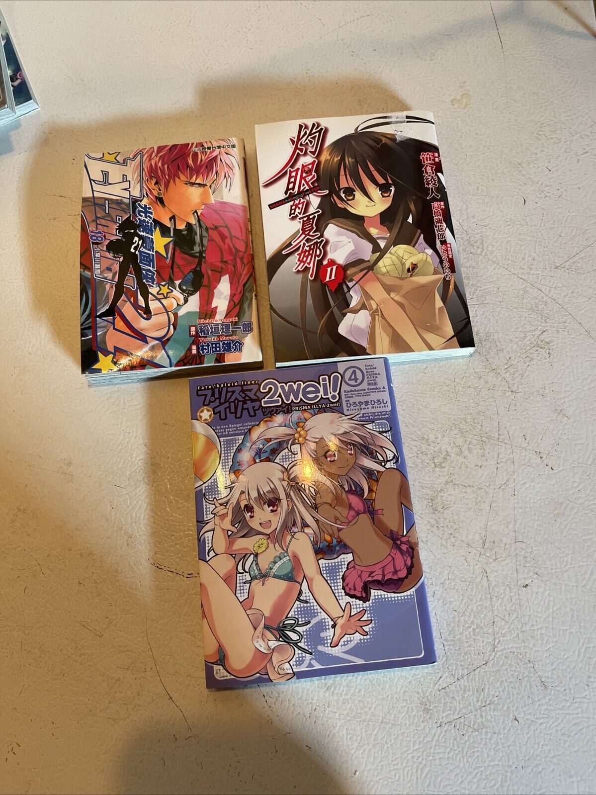 Anime book lot for sale with three manga volumes featuring colorful illustrated covers