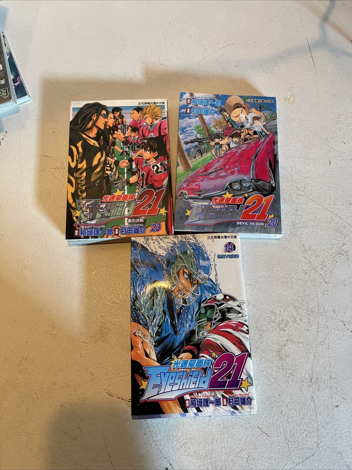 Anime book lot for sale featuring three manga volumes with colorful racing and action scenes on the covers