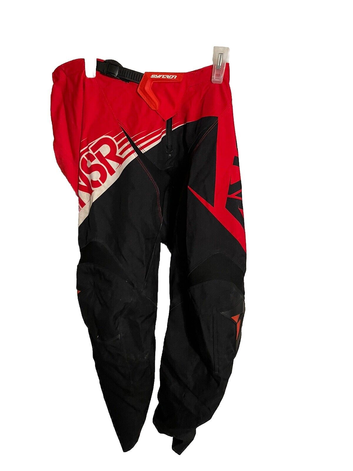 Red and black Ansr Syncron motocross pants with bold graphics and adjustable waistband