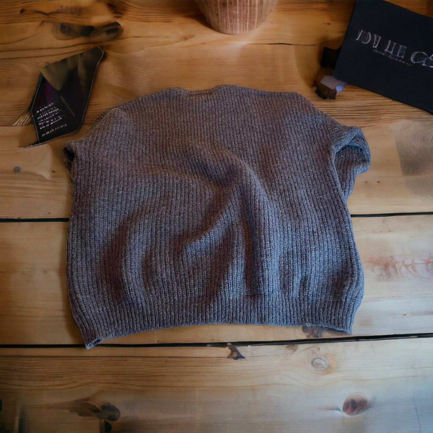 Antartex wool sweater XL in gray color laid flat on wooden surface