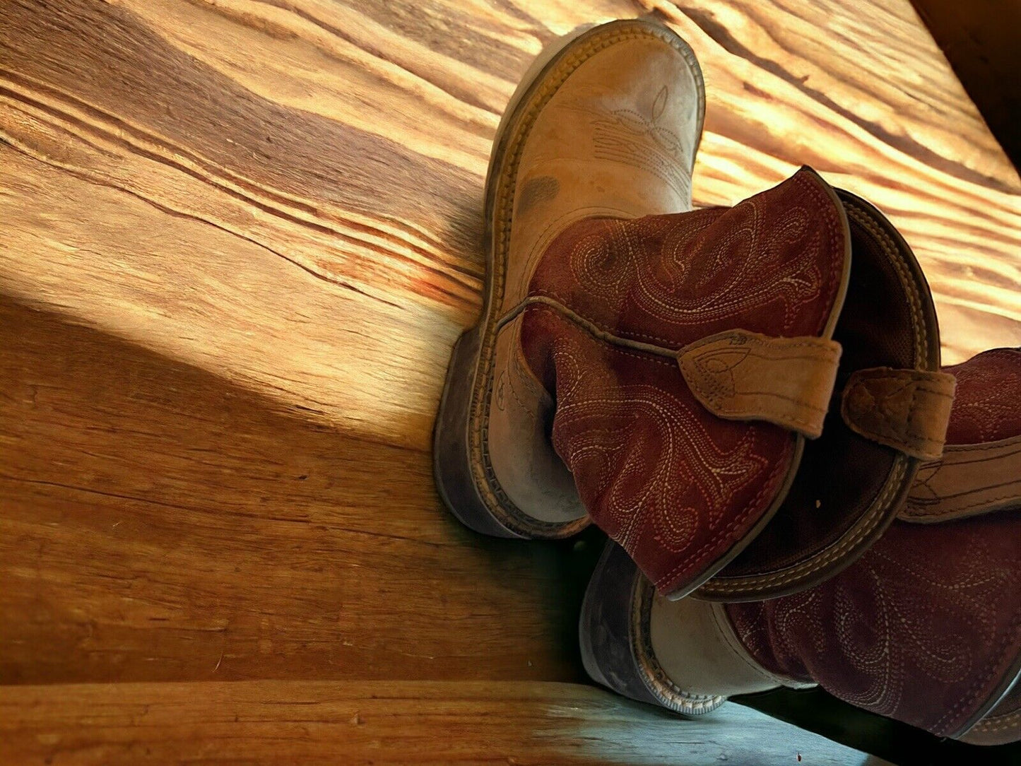 Ariat Fatbaby Heritage boots with brown leather and embroidered detailing on wooden floor