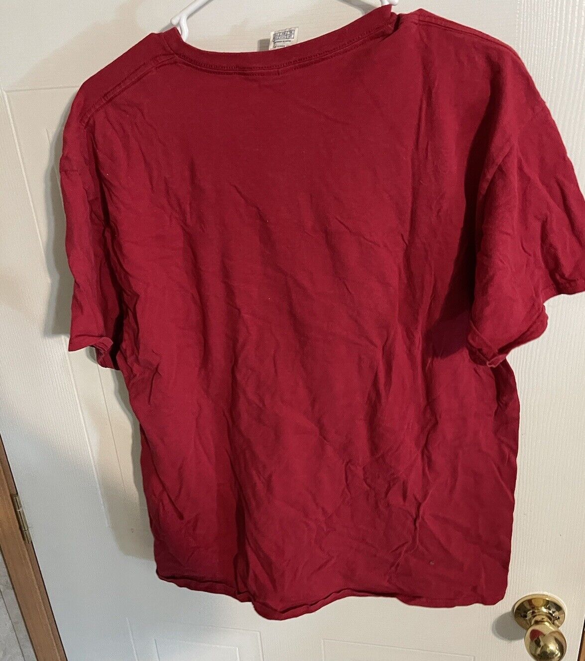 Plain red Arizona tourist t-shirt XL size hanging on white door hanger