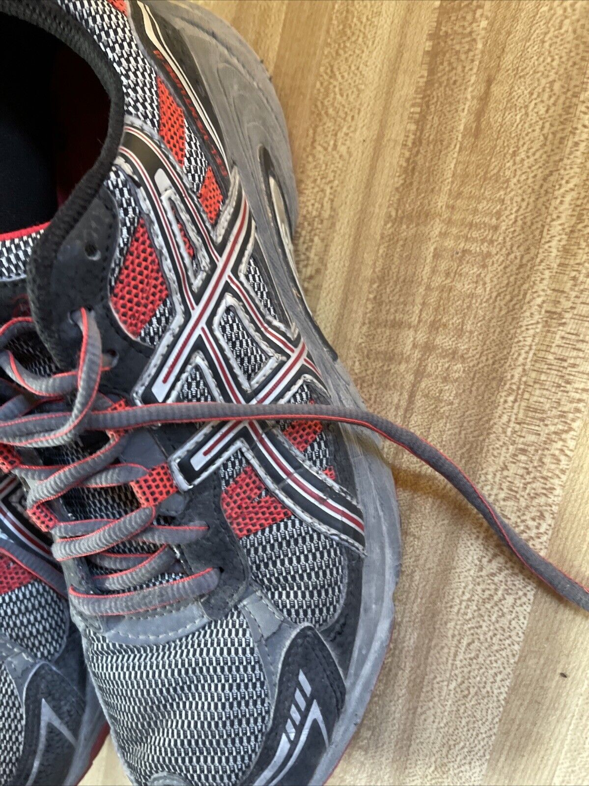 ASICS Gel Venture 4 men’s size 12 running shoes in black red and gray with mesh upper and durable outsole