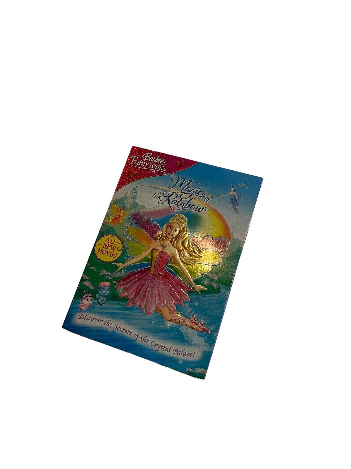 Barbie Fairytopia Magic of the Rainbow DVD cover featuring Barbie fairy in pink dress with rainbow background