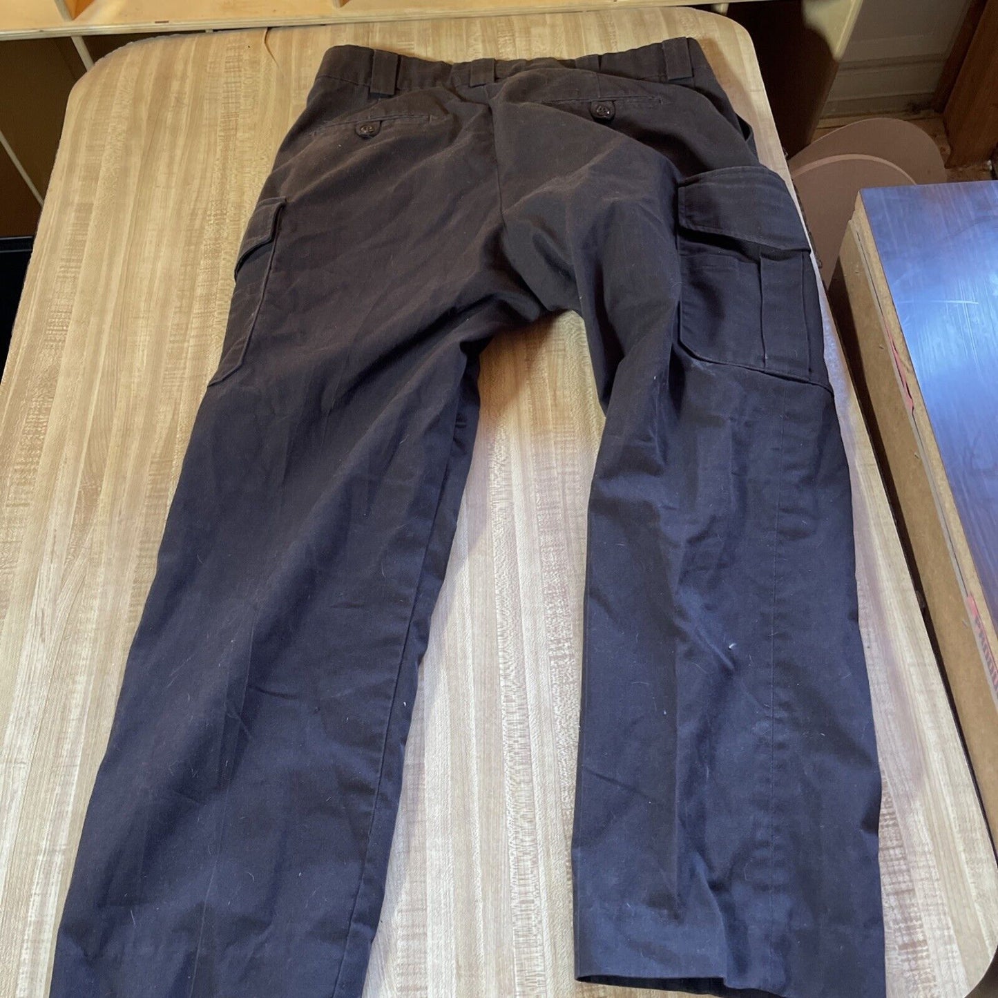 Blauer cargo pants 34 regular in dark color laid flat showing back and side pockets