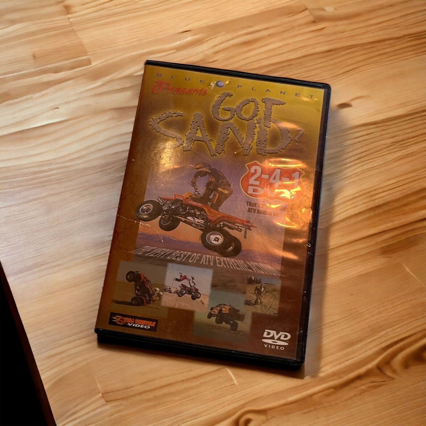 Got Sand monster truck DVD cover from the monster truck DVD collection on wooden surface