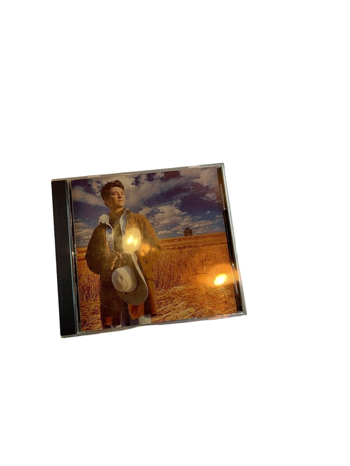 k.d. lang Absolute Torch and Twang CD featuring cover art of k.d. lang standing in a field with a cowboy hat