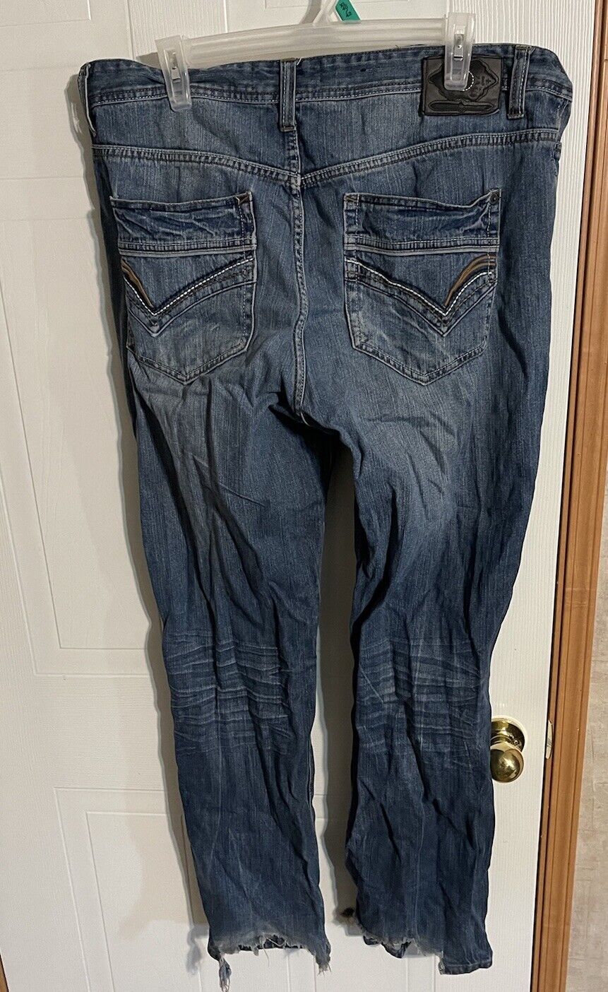 Back view of men's 96 North jeans 38x32 in faded blue denim with stitched back pockets hanging on clear hanger