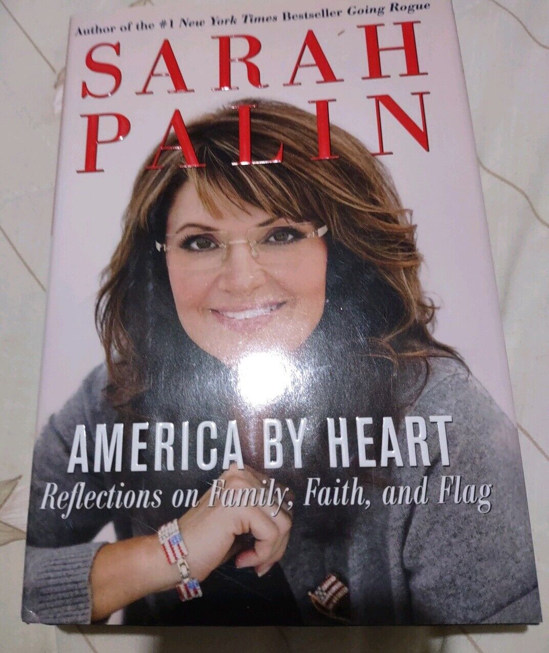 Sarah Palin America by Heart book with cover featuring Sarah Palin smiling and title in bold red and white text