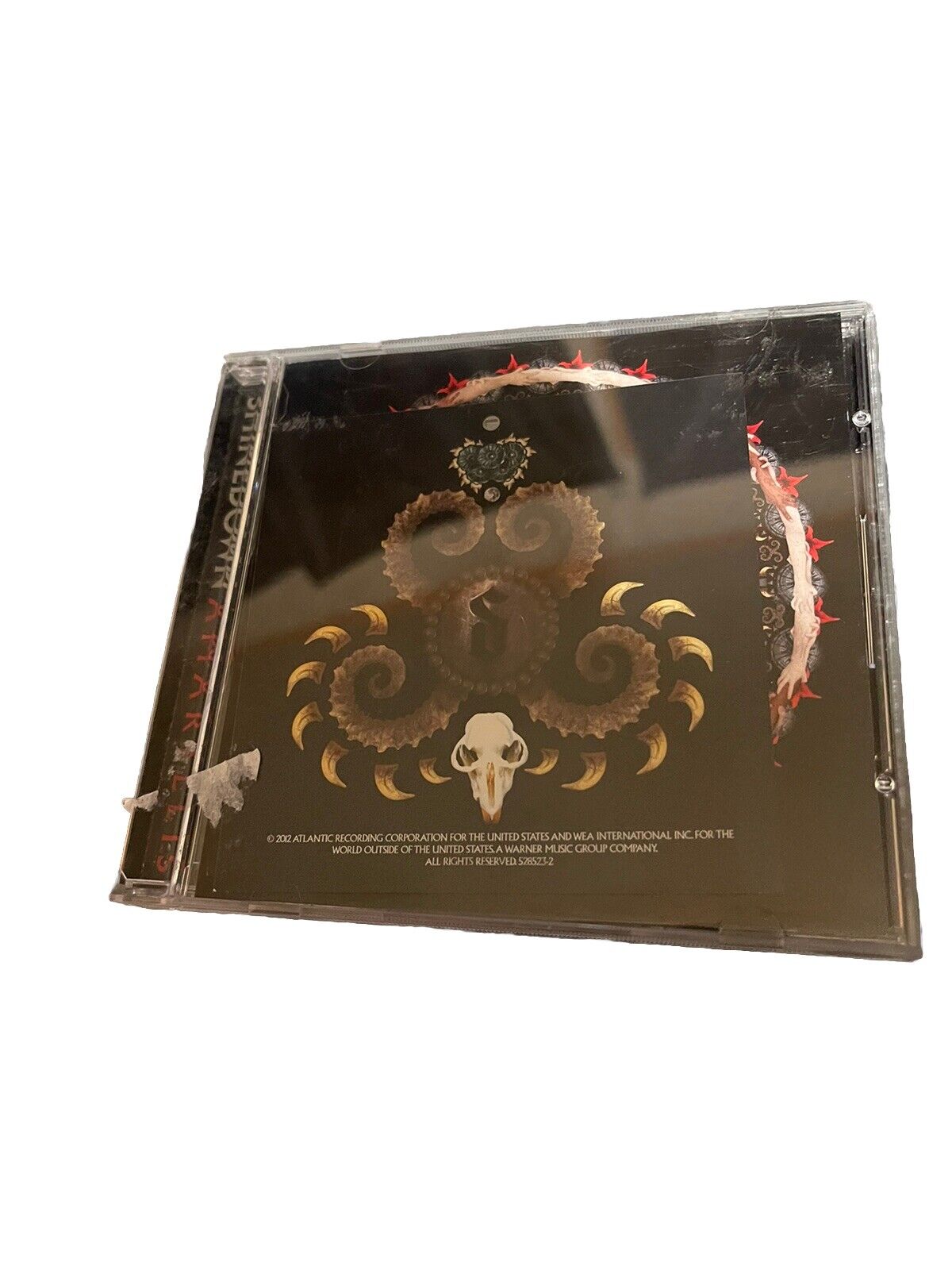 Shinedown Amaryllis CD album case featuring dark artistic cover with intricate design