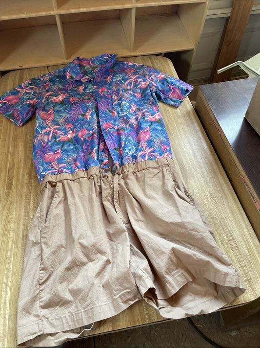 Zesties romper for summer with blue and pink tropical floral top and beige shorts