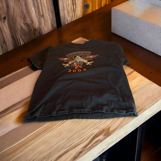 2004 Bike Week t shirt in black with flame graphic and event logo laid flat on wooden table