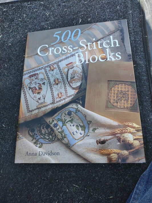 500 Cross-Stitch Blocks book by Anna Davidson featuring a cross stitch pattern book with various stitch designs
