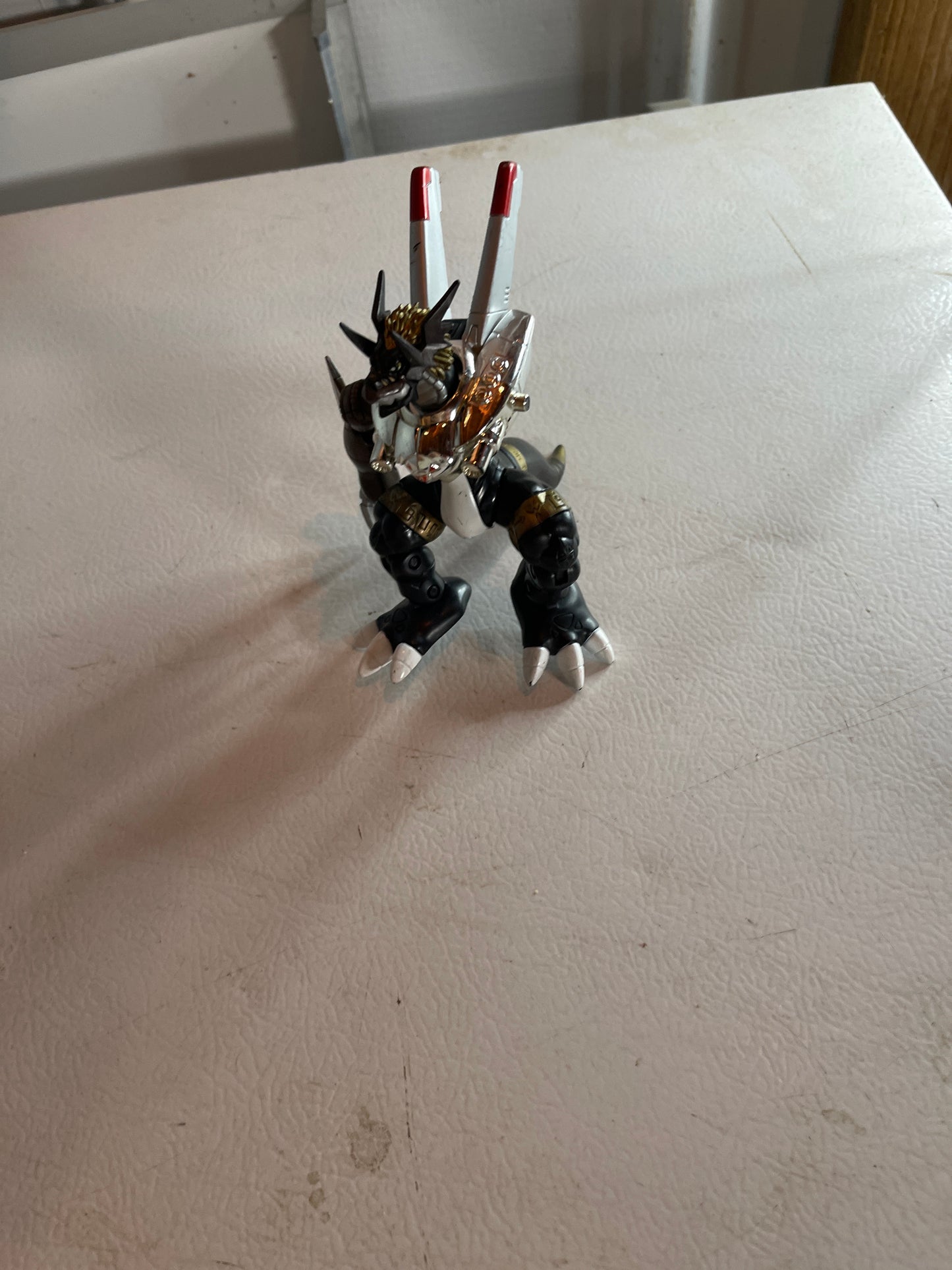 Digimon action figure as is missing an arm