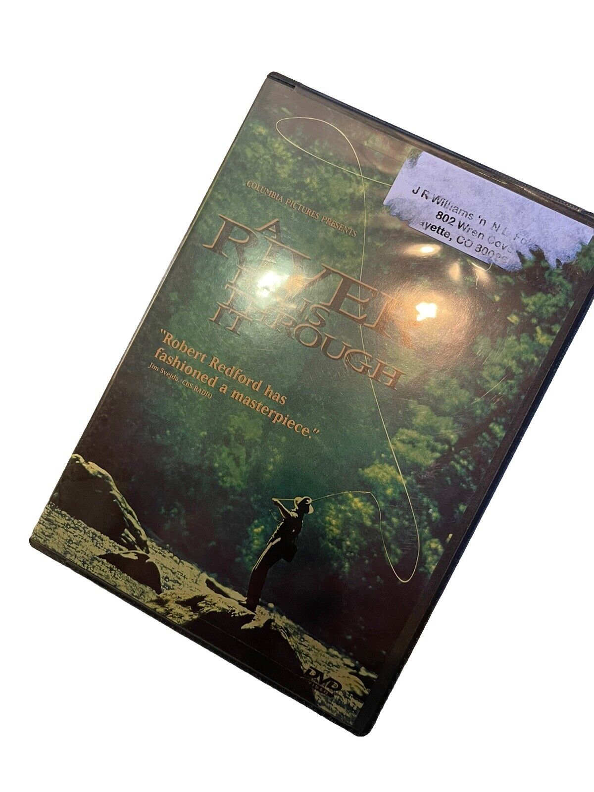 A River Runs Through It DVD case featuring scenic fishing artwork and Robert Redford quote