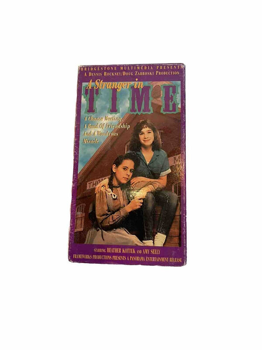 A Stranger In Time VHS tape featuring two women on the cover in vintage style packaging