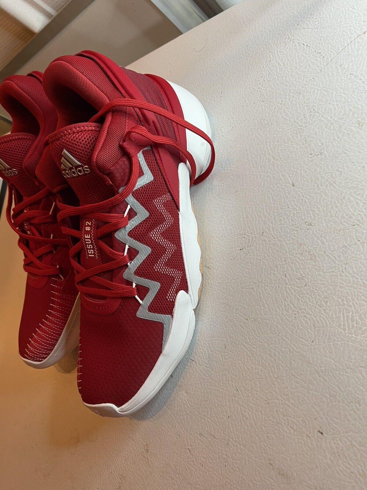Red adidas D.O.N. Issue 2 size 13 basketball shoes with white zigzag design and red laces