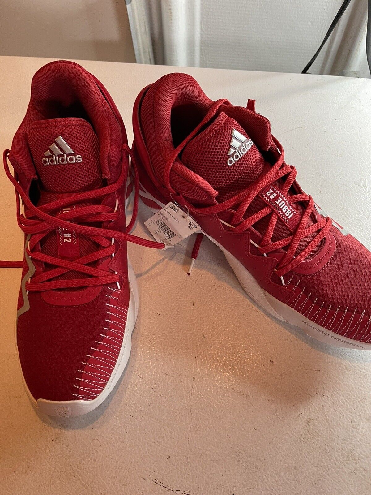 Red adidas D.O.N. Issue 2 size 13 basketball shoes with white soles and logo on tongue