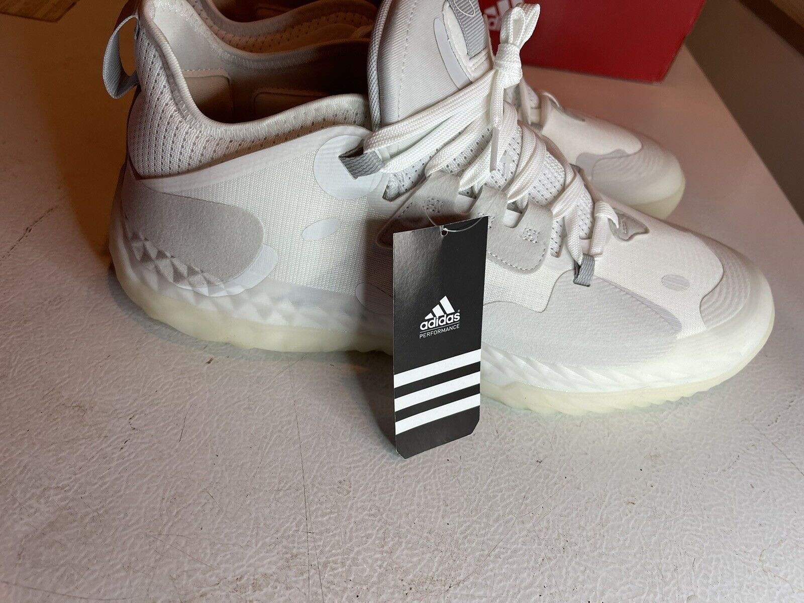 White Adidas Harden Vol 5 Futurenatural basketball shoes with translucent sole and black Adidas tag