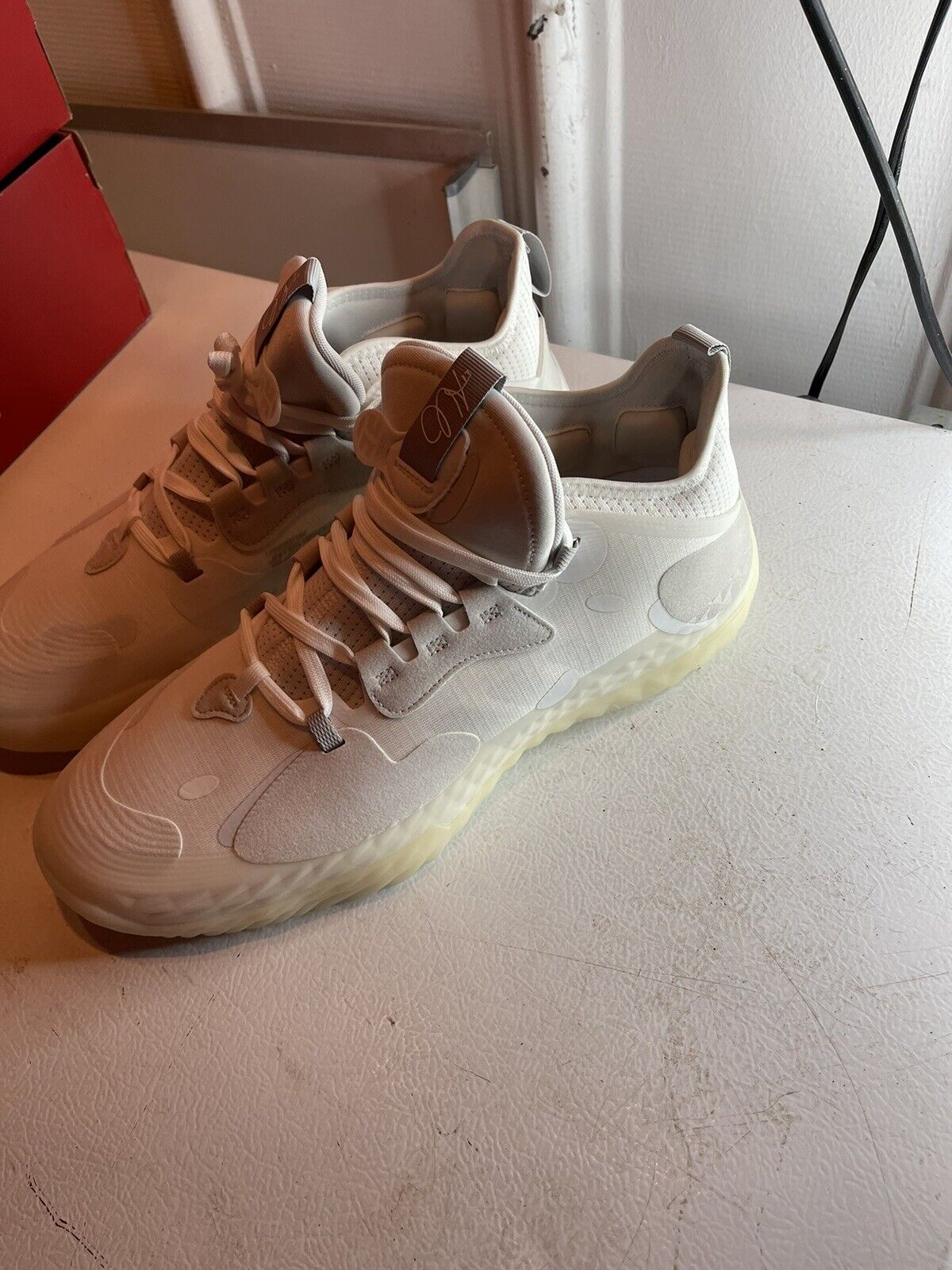 White Adidas Harden Vol 5 Futurenatural basketball shoes with translucent sole and detailed upper design