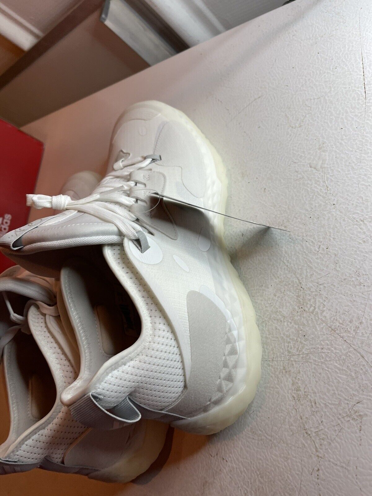 White Adidas Harden Vol 5 Futurenatural basketball shoes with translucent sole and textured design