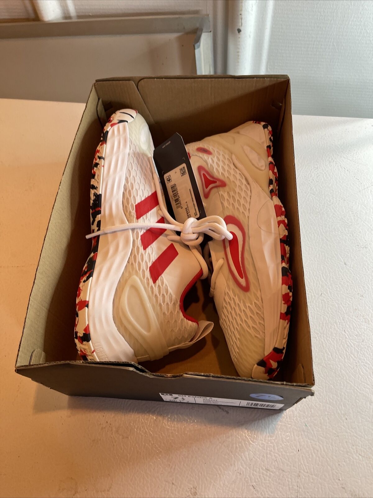 Adidas SM Exhibit A Team USA white and red athletic shoes in a cardboard box