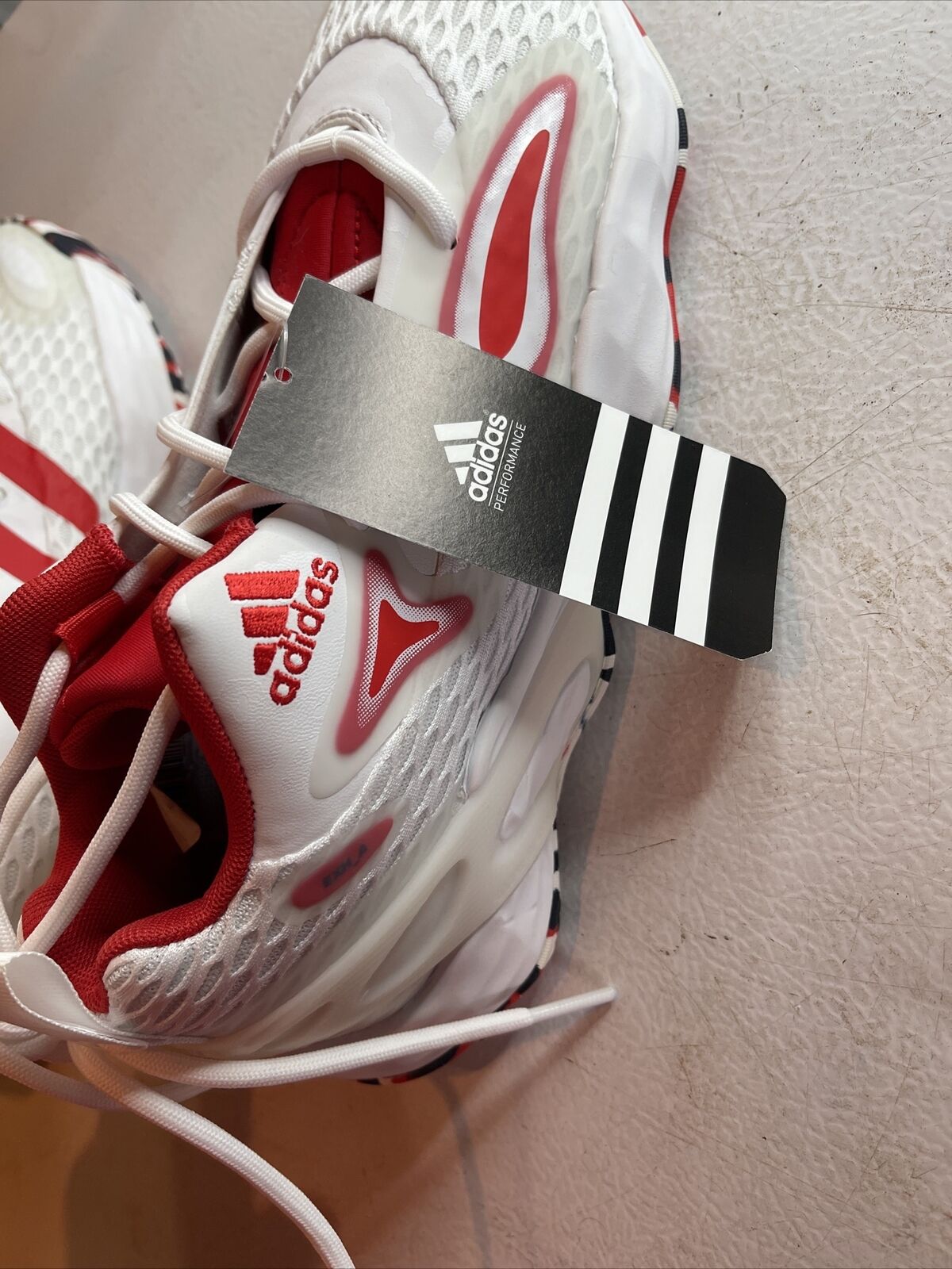 Adidas SM Exhibit A Team USA sneakers in white and red with branded Adidas tag attached