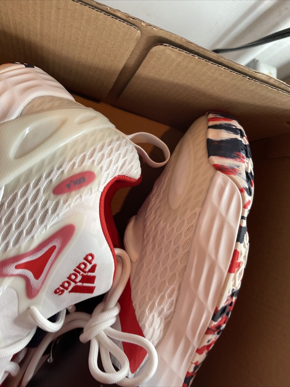 Adidas Team USA sneakers size 12 in white with red accents and patterned sole inside a cardboard box